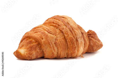Fresh and tasty croissant over isolated white background