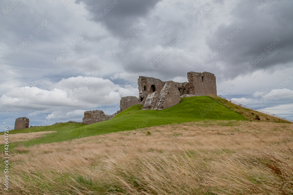 Duffus castle with cloudy sky Duffus castle with cloudy sky