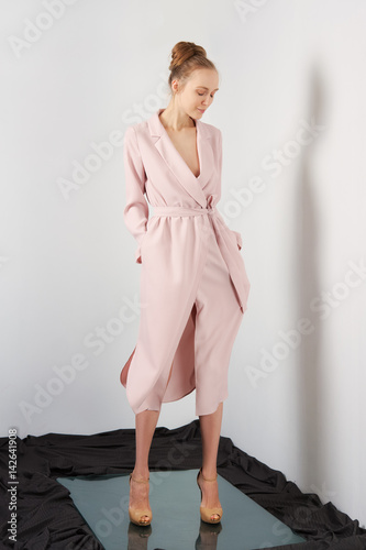 Happy girl in light peach long dress