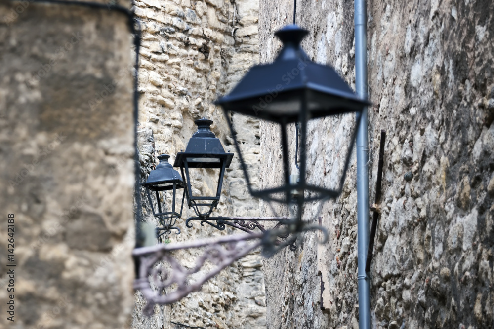 Ancient  lamps on the street. Europe.