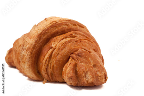 Fresh and tasty croissant over isolated white background