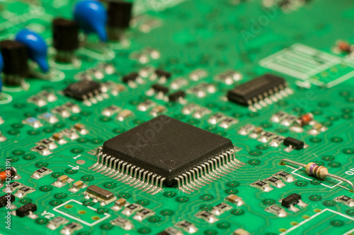smd printed electronic circuit board with micro controller and components, shallow dof