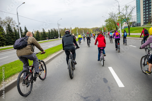 Fototapeta Naklejka Na Ścianę i Meble -  BELARUS, MINSK - APRIL 30/2016: On the central streets of Minsk hosted the annual bicycle carnival in which everyone participated.