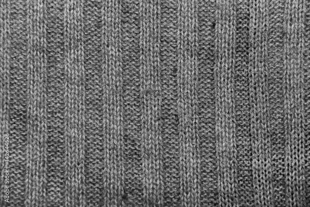 Black and white background texture, knitted sweater with a pattern Black and white background texture, knitted sweater with a pattern
