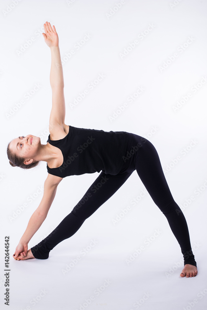 advanced yoga posture, demonstrated by bloden girl, dressed in black, on white background