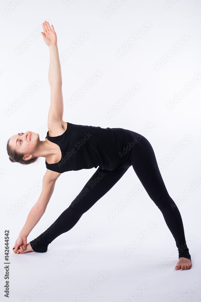 advanced yoga posture, demonstrated by bloden girl, dressed in black, on white background advanced yoga posture, demonstrated by bloden girl, dressed in black, on white background