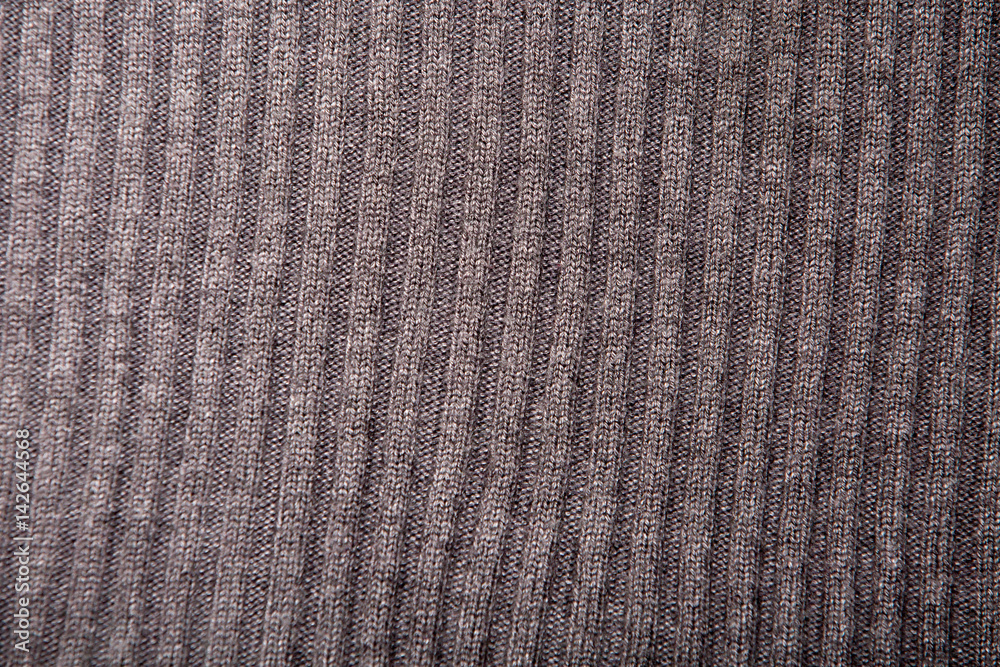 Background texture, brown knitted sweater with a pattern