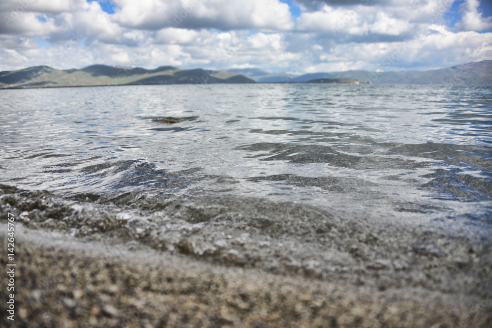 Wave rolling on the shore on Lake Sevan