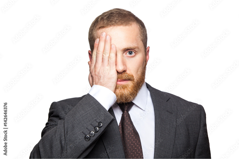 Portrait of handsome businessman covering one eye with his hand as he looks directly at the camera. isolated on white background. Portrait of handsome businessman covering one eye with his hand as he looks directly at the camera. isolated on white background.