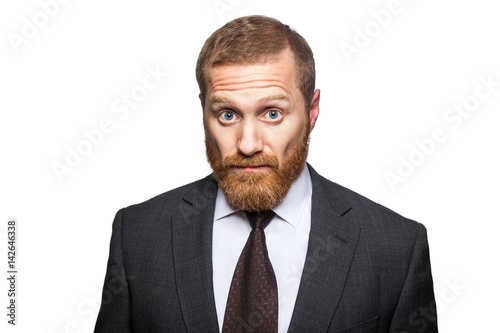 Shocked surprised businessman looking at camera with big eyes. isolated on white, looking at camera. © khosrork