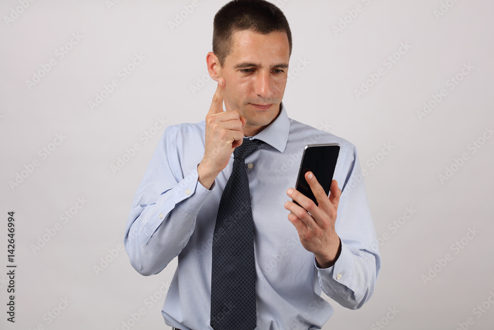 Furious businessman on mobile phone. Nervous man with smarth, celular phone. Furious businessman on mobile phone. Nervous man with smarth, celular phone.