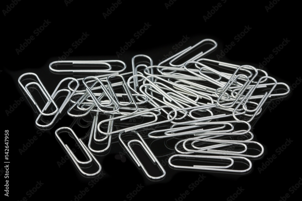 Paper clips on a black background Paper clips on a black background