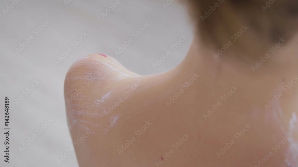 Bodyart painting: professional make-up artist making body art in white room. Body paint, visage and fashion concept Bodyart painting: professional make-up artist making body art in white room. Body paint, visage and fashion concept