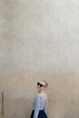 Portrait of a woman against the blank wall. Copy space for your text.