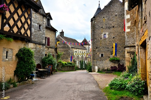Picturesque street in a medieval village in Burgundy, France