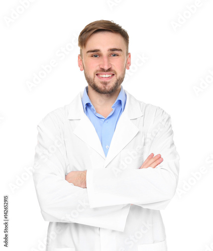 Handsome doctor with crossed hands on white background © Africa Studio