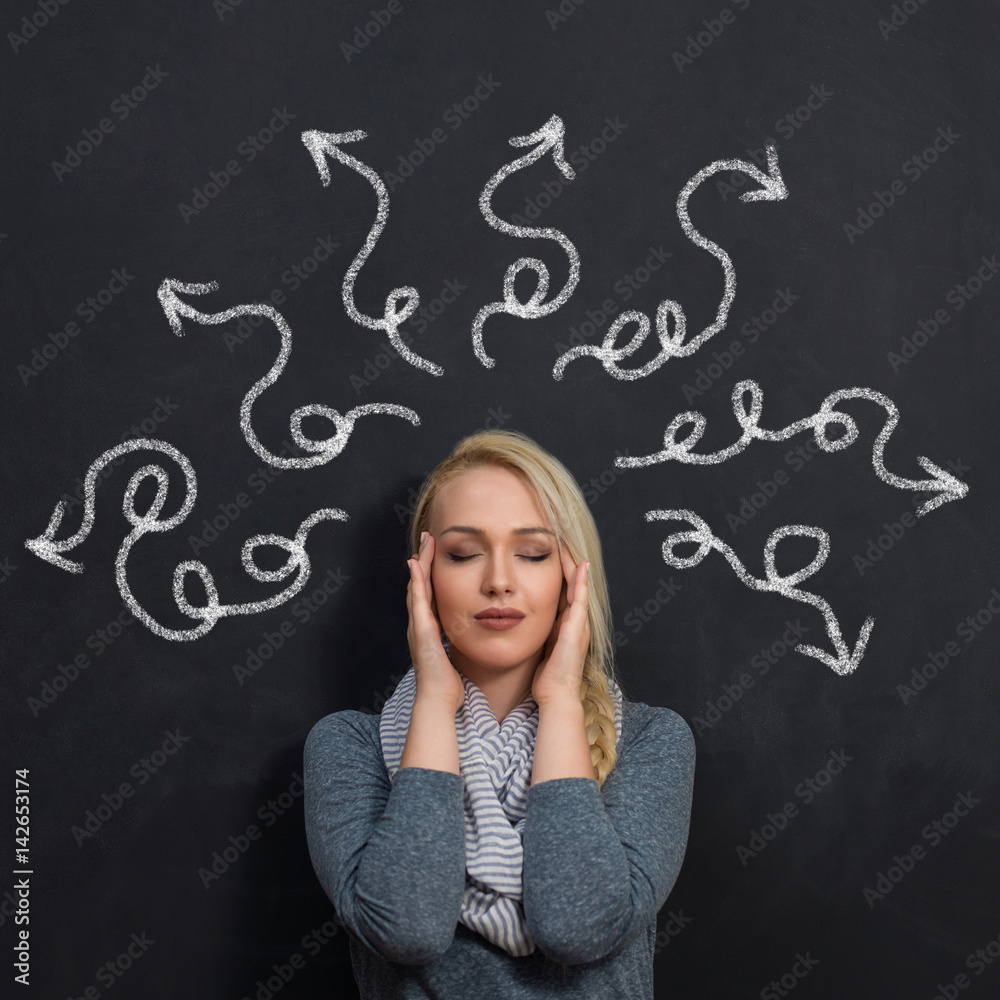Woman holding her head with both hands. Stressed out. Thinking about deadlines, boubt, bills, money, job, work, overload work, taxes, etc. Woman holding her head with both hands. Stressed out. Thinking about deadlines, boubt, bills, money, job, work, overload work, taxes, etc.