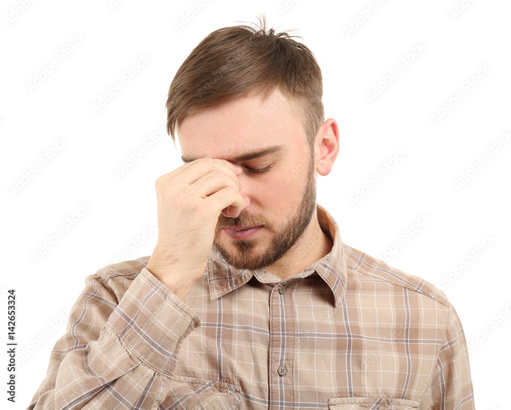 Young man suffering from headache on white background Young man suffering from headache on white background