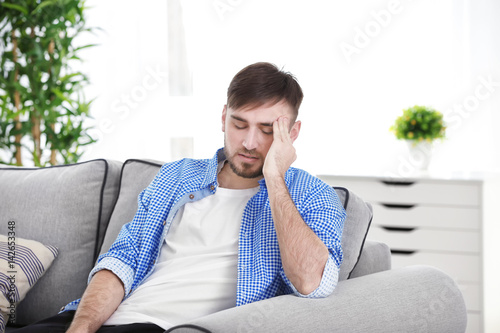 Young man suffering from he...