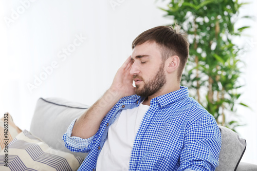 Young man suffering from he...