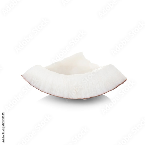 Tasty piece of coconut on white background