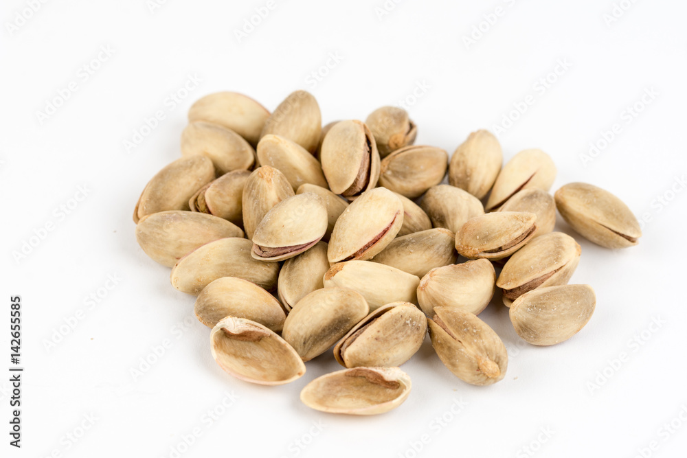 Pile of roasted pistachio over white background Pile of roasted pistachio over white background