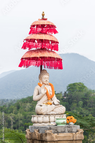Buddha statue buddha image used as amulets of Buddhism religion. Tropical island Bali, Indonesia. North of Bali. photo
