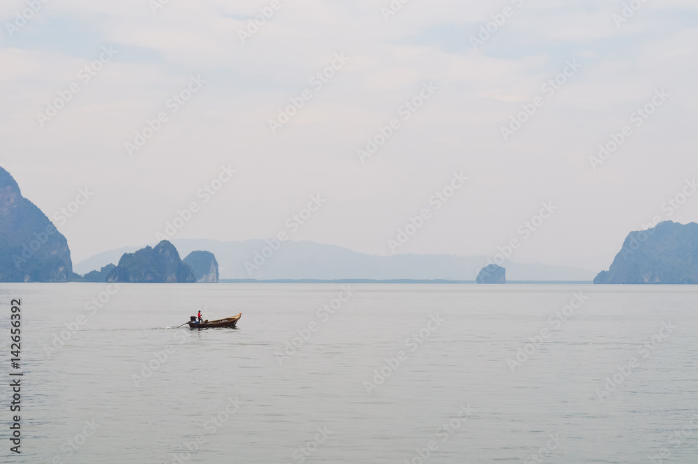 A lonely longtail boat in Phang Nga bay
