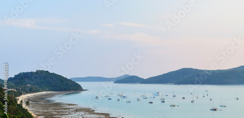 boats and yachts anchored in the bay at low tide