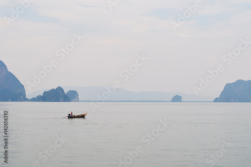 A lonely longtail boat in Phang Nga bay