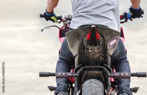 cropped image  of man driving motocycle