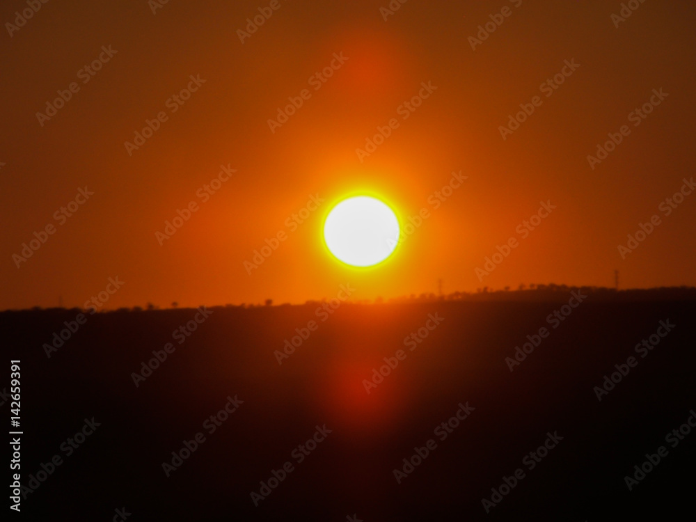 Soft focus orange sunset over rural land in South Australia