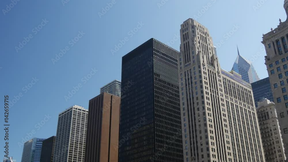 Tilt down from the skyscrapers to the Chicago river Tilt down from the skyscrapers to the Chicago river