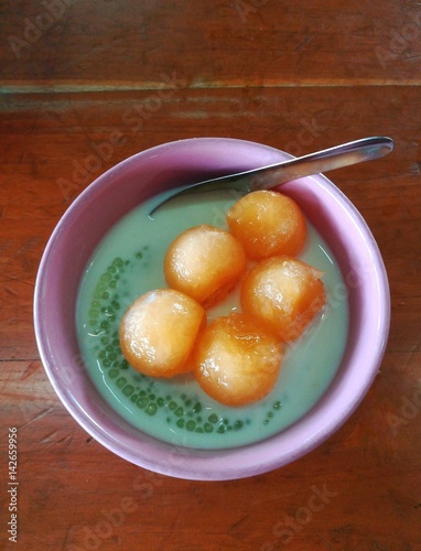 Thai dessert, Sakoo Piak, Sago and Coconut boiled in syrup and topped with thick melon. photo