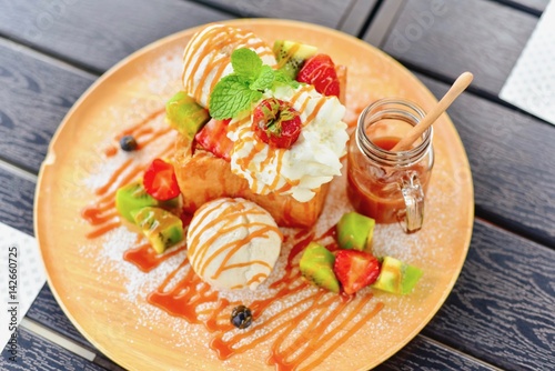 Top View of Honey Toast with Butterscotch Sauce on a Wooden Platter