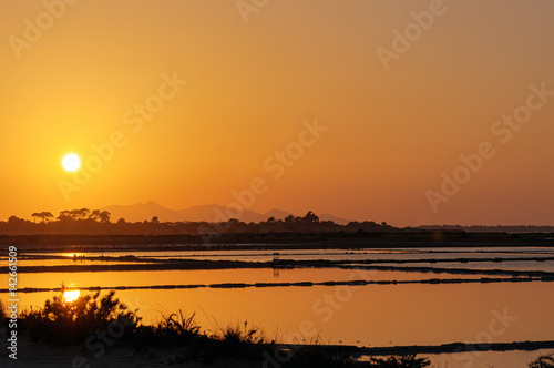 Sunset at the saltpans of Marsala in Sicily