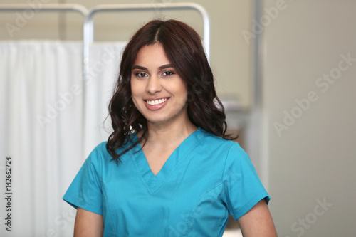  Portrait of a young attractive hispanic healthcare worker.