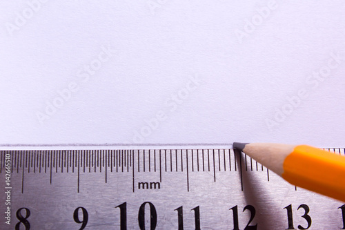 A straight line is drawn with a pencil using a ruler. Empty space for text