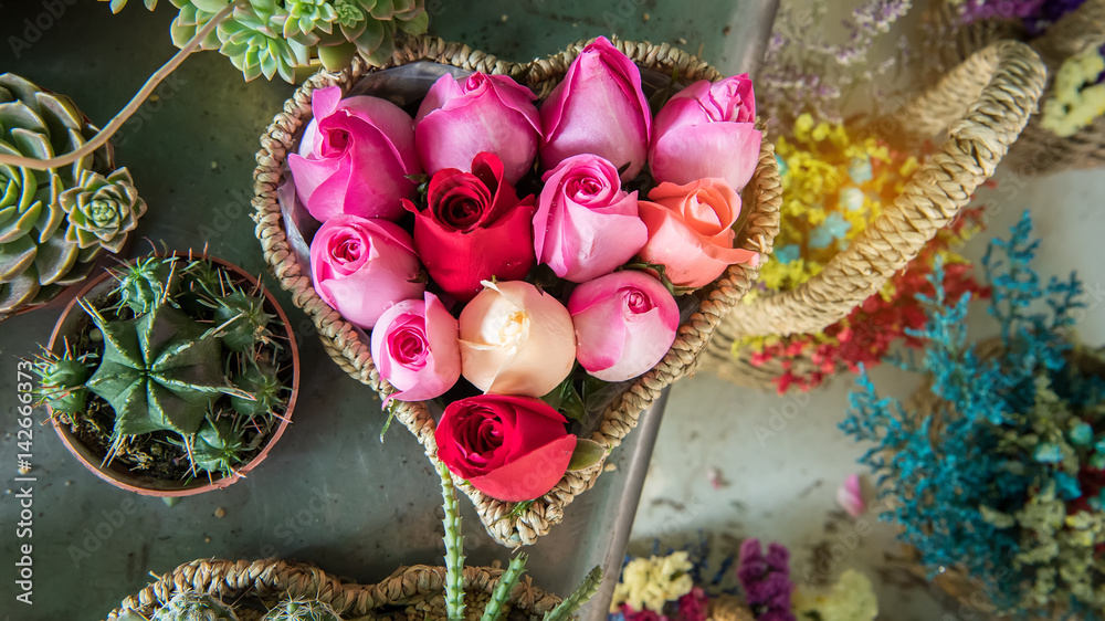 Roses bouquet in heart shape basket
