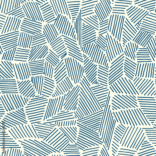 Vector seamless pattern of painted strips in a different direction, blue on a light yellow background