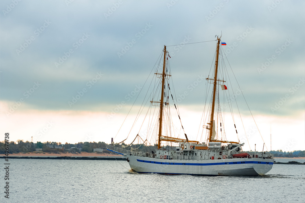 White sailing ship coming from Baltic sea and entering Riga