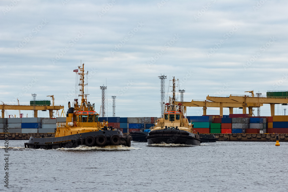 Tug ships in the cargo port of Riga, Europe