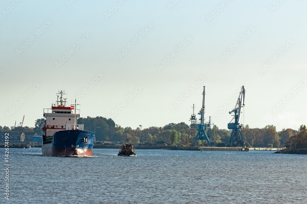 Blue cargo ship leaving the port of Riga Blue cargo ship leaving the port of Riga