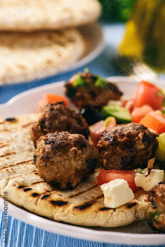 Greek meatballs (keftedes) with pita bread and tzatziki dip. photo