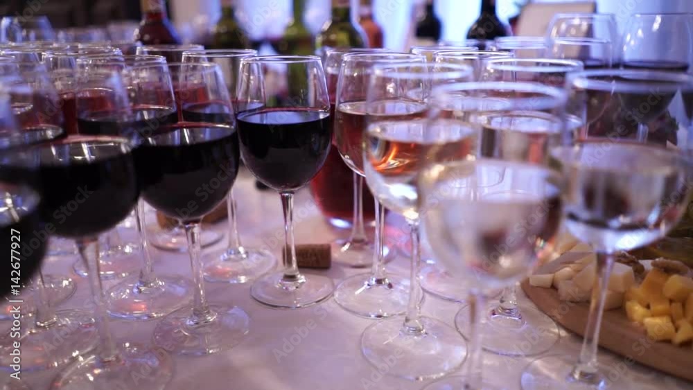 Glasses with alcohol drinks, glasses of wine and champagne are on the buffet table, red wine in glasses, champagne by the glass, buffet table with alcohol in a restaurant, view from above, top Glasses with alcohol drinks, glasses of wine and champagne are on the buffet table, red wine in glasses, champagne by the glass, buffet table with alcohol in a restaurant, view from above, top