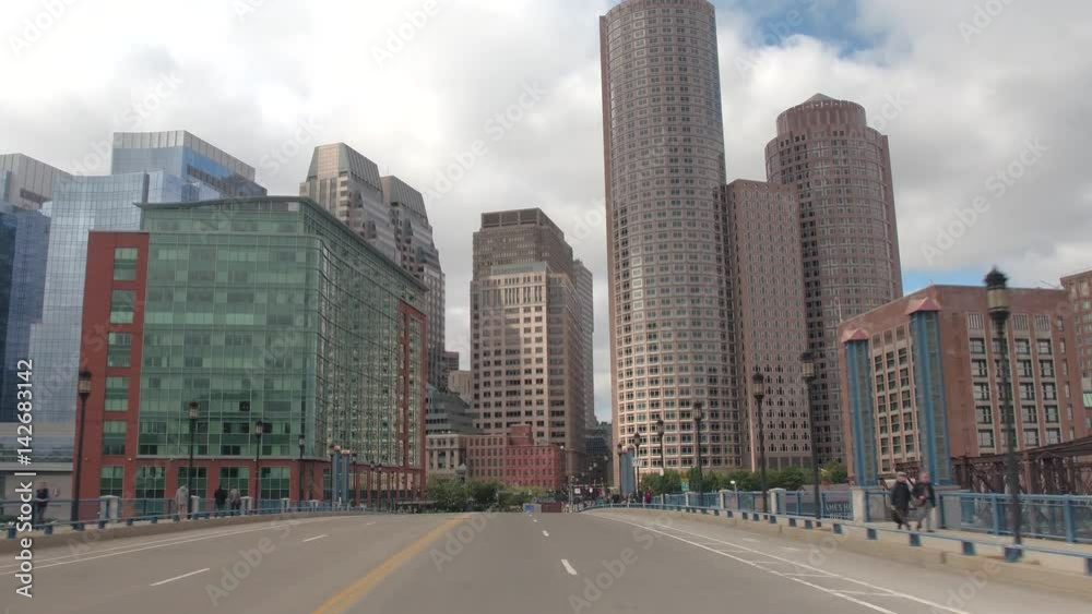 FPV, CLOSE UP: Traveling towards high glassy window pattern skyscrapers in Downtown Boston financial district skyline, USA. Driving on busy highway in metropolitan city overlooking office buildings FPV, CLOSE UP: Traveling towards high glassy window pattern skyscrapers in Downtown Boston financial district skyline, USA. Driving on busy highway in metropolitan city overlooking office buildings