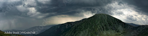 Panoramic view over Carpathian Mountains , Romania in a cold summer day