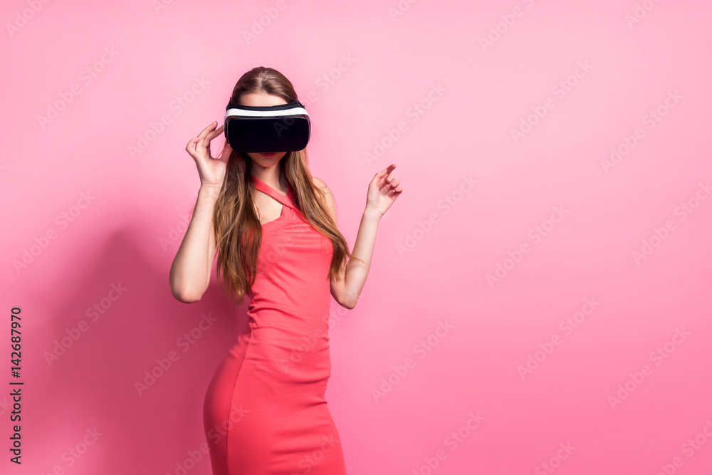 Happy young woman using a virtual reality headset Happy young woman using a virtual reality headset