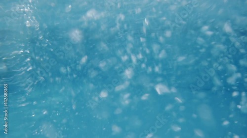 Sliding down in water slide at aquapark.