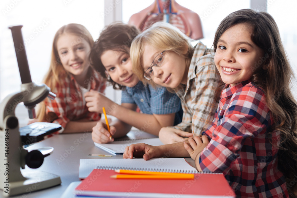 Team of little scientists enjoying biology class together Team of little scientists enjoying biology class together